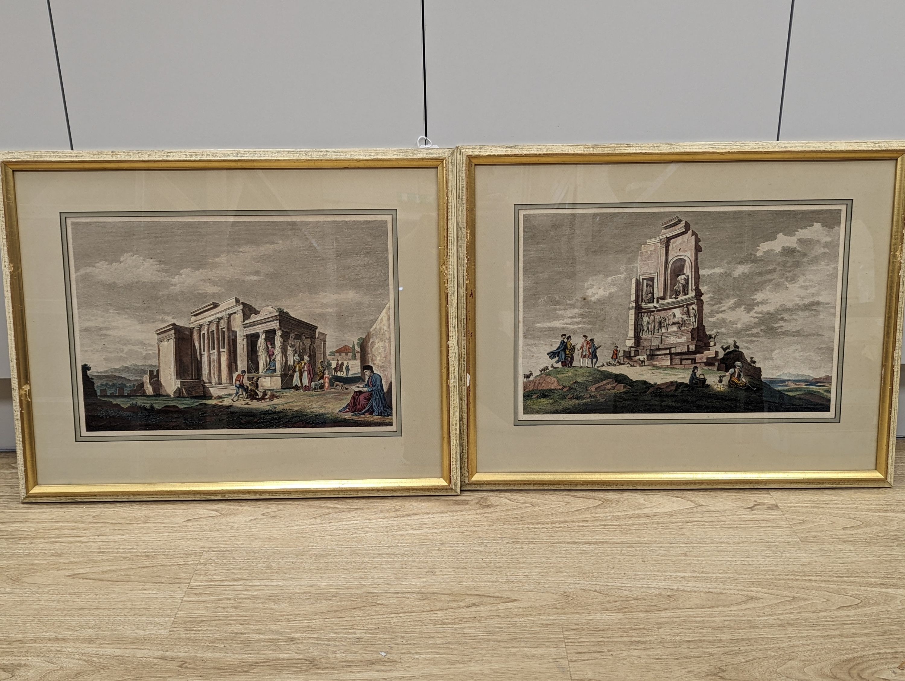 After Stuart & Revett, pair of hand coloured engravings of figures amongst Greek temples, 30 x 45cm